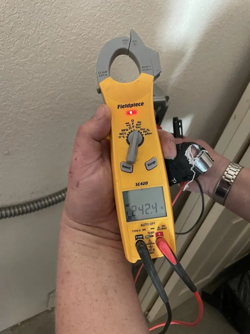 Voltage testing with clamp meter during Outlet Installation in St. Robert